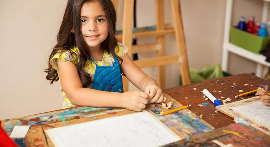 A child enjoying a creative activity at our kindergarten